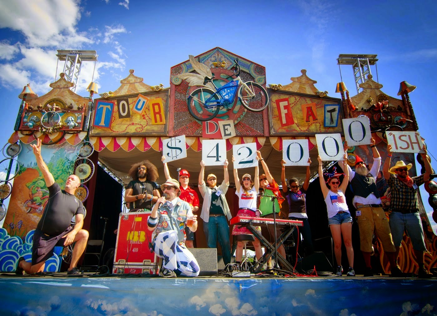 Group presents money raised by the New Belgium Tour de Fat bike race on stage at the Yards DC