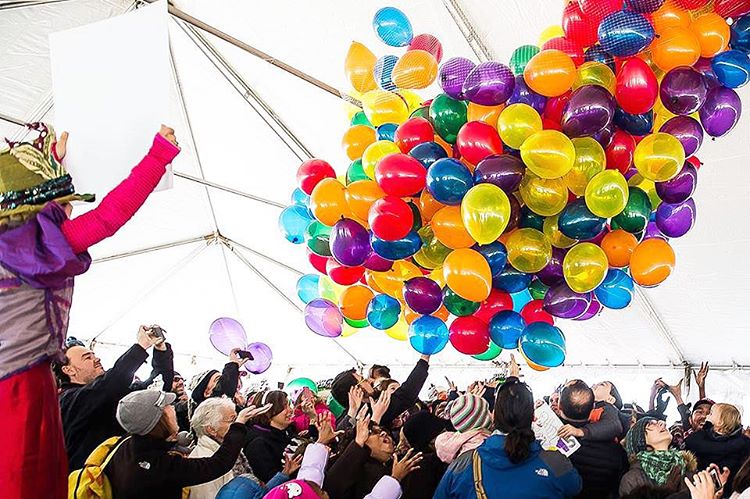 Big stack of balloons inside of tent at a family friendly New Years event in DC