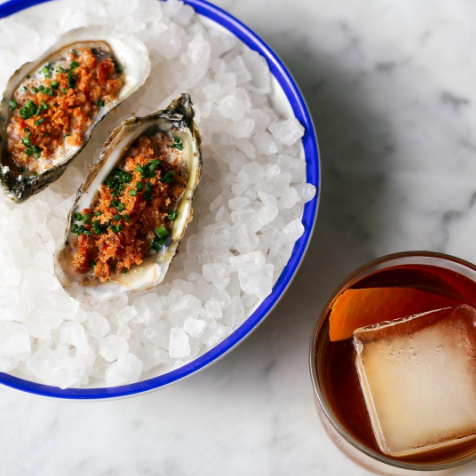 Upscale seafood with whiskey on the rocks prepared at a waterfront restaurant