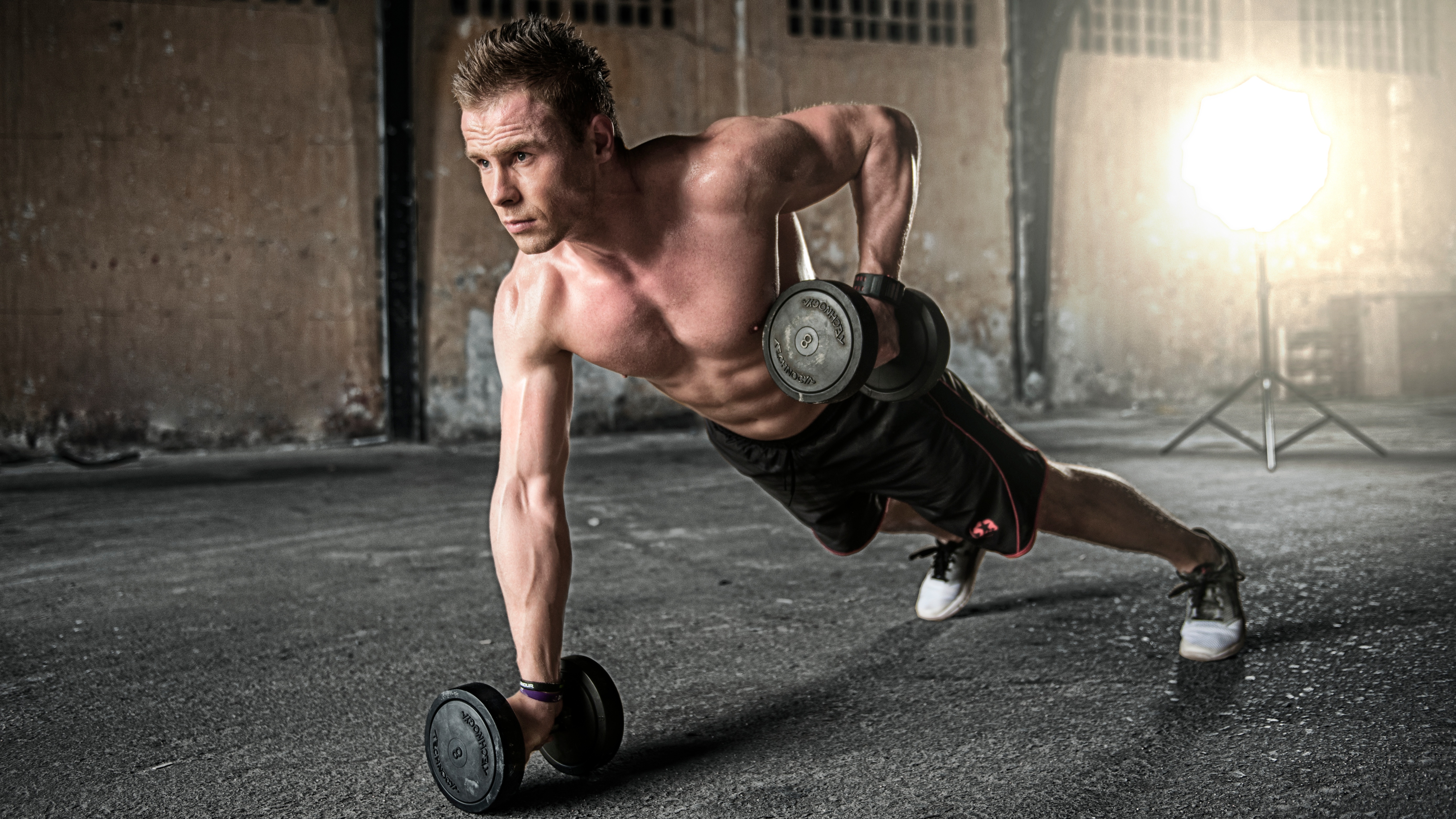 Man working out in athletic shorts and sneakers