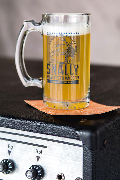 Large mug of beer on top of an amp