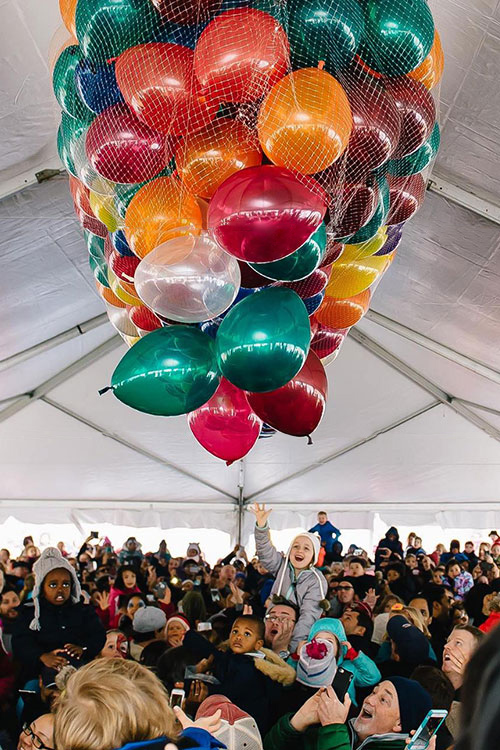 Big stack of balloons inside of tent at a family friendly New Years event in DC