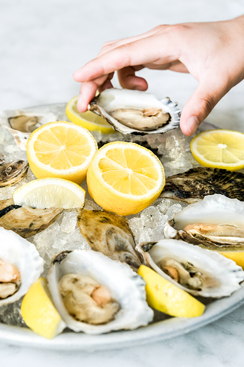 Fresh oysters and lemon at a seafood event in Anacostia