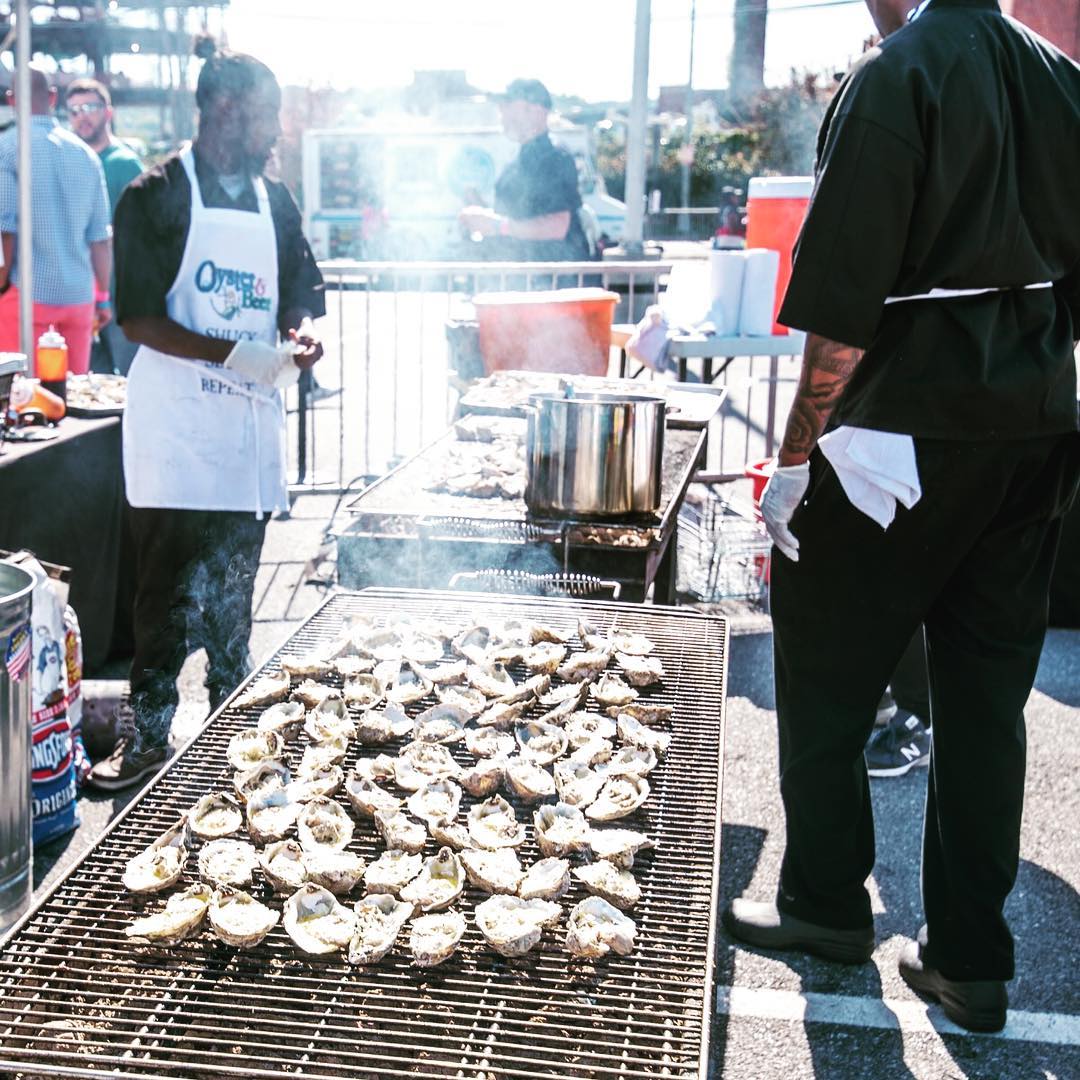 Oysters being grilled outside during a festival event in DC