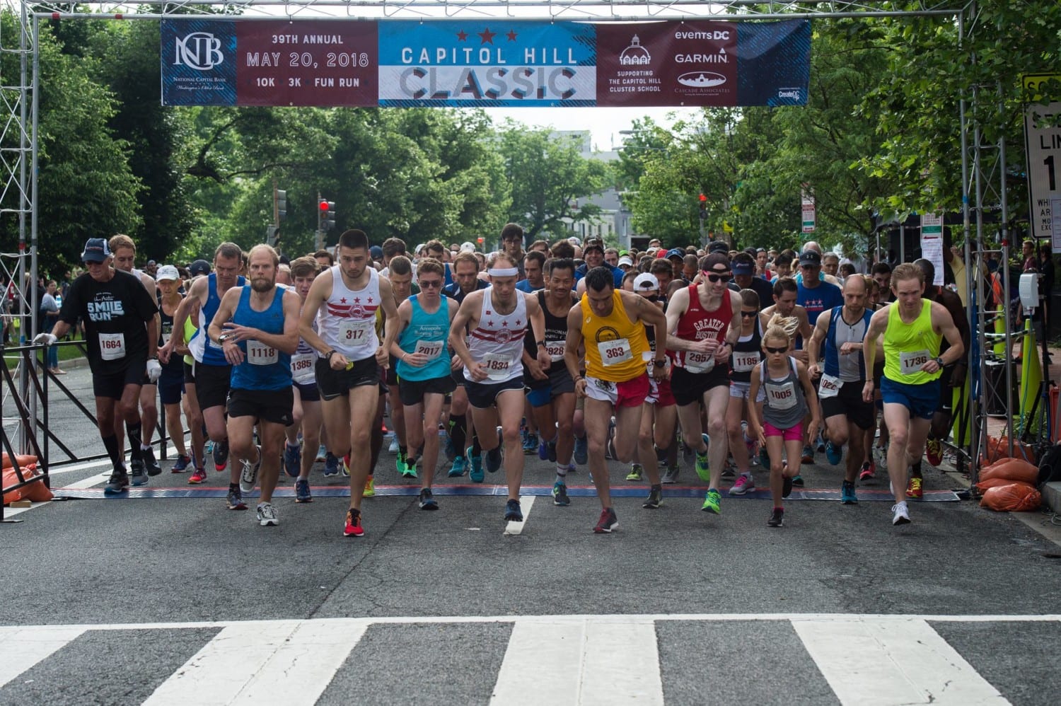 Runners begin a race on Capitol Hill
