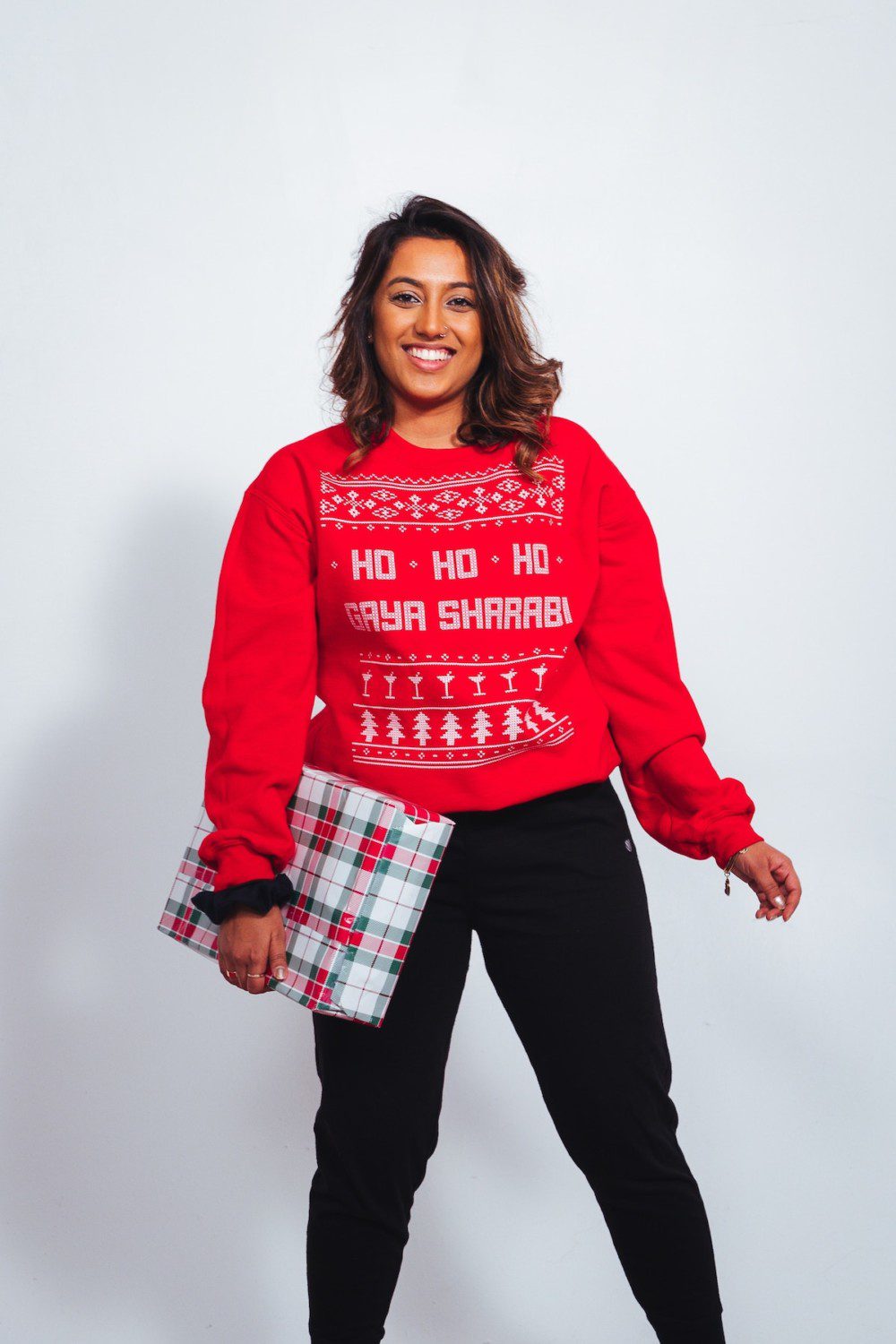 Woman in red Christmas sweater ho-ho-ho