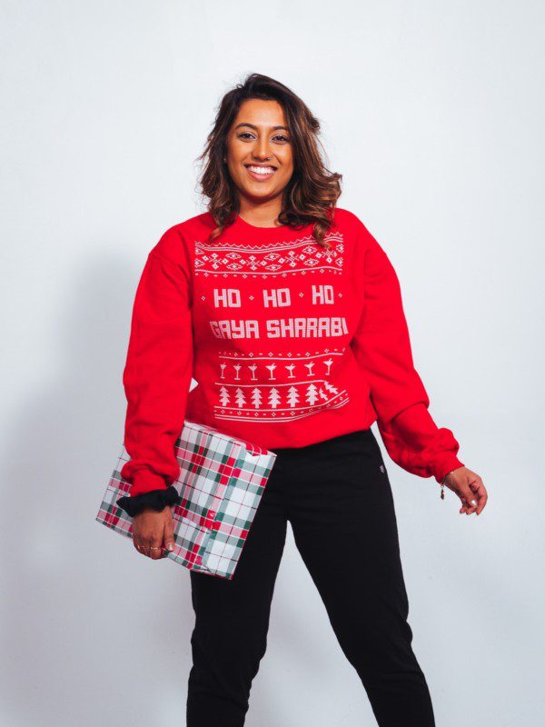 Woman in red Christmas sweater ho-ho-ho